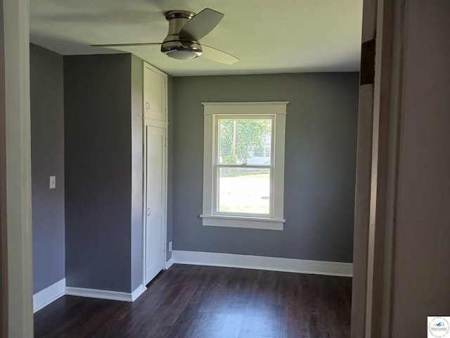 501 S Oak St, Versailles, MO 65084 - unfurnished room with dark wood-style floors and a ceiling fan
