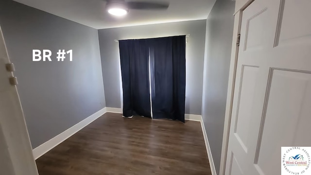501 S Oak St, Versailles, MO 65084 - corridor featuring baseboards and dark wood-style flooring