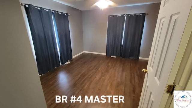 501 S Oak St, Versailles, MO 65084 - spare room featuring wood finished floors and ceiling fan