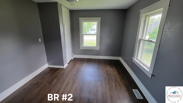 501 S Oak St, Versailles, MO 65084 - unfurnished room featuring plenty of natural light and dark wood-type flooring