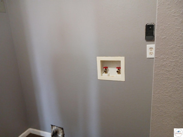 501 S Oak St, Versailles, MO 65084 - laundry room with a textured wall and hookup for a washing machine