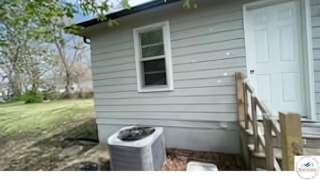 107 W Benton St, Clinton, MO 64735 - view of side of home with a central air condition unit
