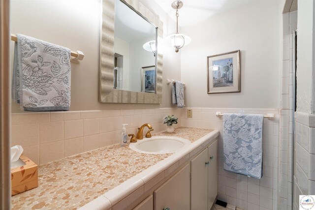 7020 Walnut Cir, Sedalia, MO 65301 - bathroom with tile walls and vanity
