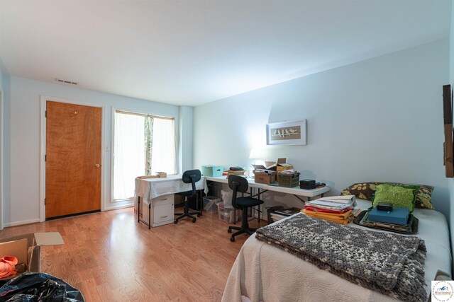 7020 Walnut Cir, Sedalia, MO 65301 - bedroom with visible vents and light wood-type flooring