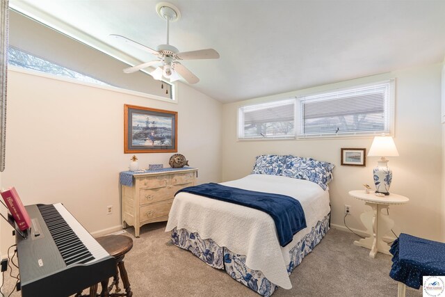 7020 Walnut Cir, Sedalia, MO 65301 - carpeted bedroom with lofted ceiling, ceiling fan, and baseboards