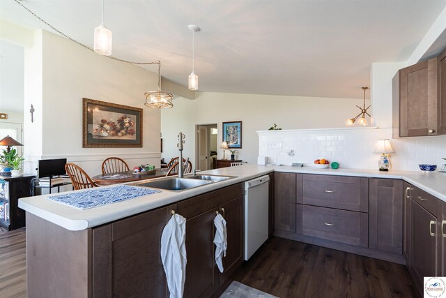 7020 Walnut Cir, Sedalia, MO 65301 - kitchen with vaulted ceiling, tasteful backsplash, white dishwasher, a peninsula, and dark wood-style floors