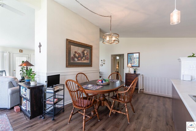 7020 Walnut Cir, Sedalia, MO 65301 - dining space with a chandelier, vaulted ceiling, and wood finished floors