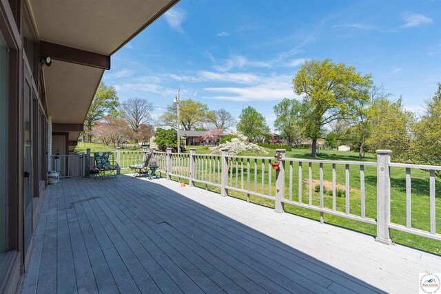 7020 Walnut Cir, Sedalia, MO 65301 - wooden deck with a lawn