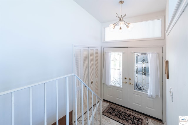7020 Walnut Cir, Sedalia, MO 65301 - foyer entrance with a chandelier, french doors, and a healthy amount of sunlight