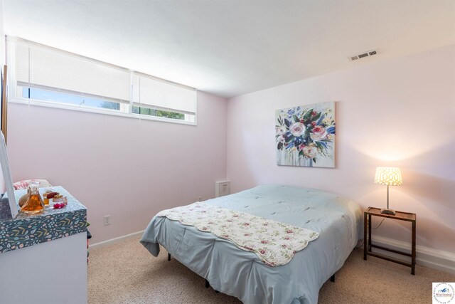 7020 Walnut Cir, Sedalia, MO 65301 - carpeted bedroom featuring visible vents and baseboards