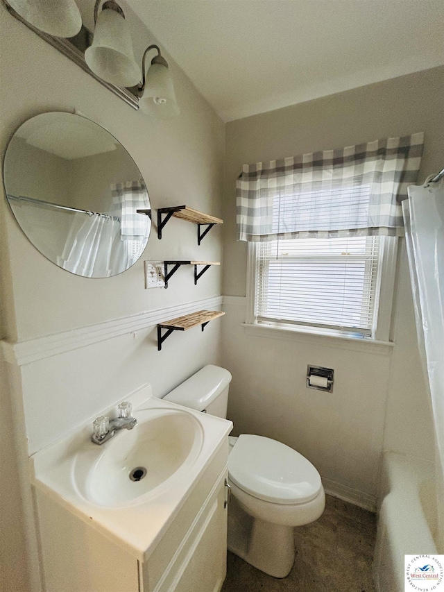 607 Laurel St, Warrensburg, MO 64093 - bathroom with vanity, toilet, and a shower with shower curtain