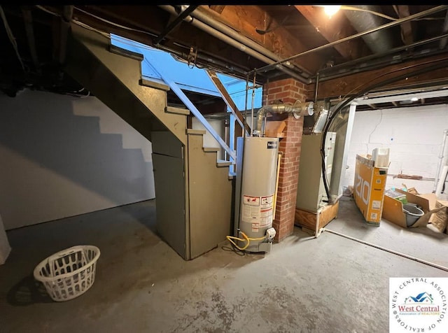 607 Laurel St, Warrensburg, MO 64093 - unfinished basement featuring stairs and gas water heater