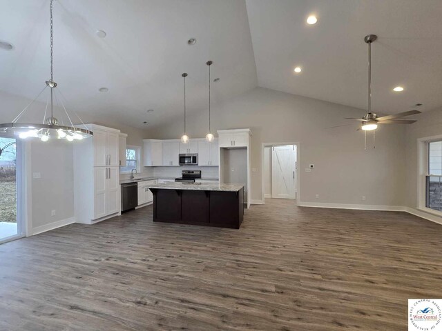 61 NW 247th Rd, Clinton, MO 64735 - kitchen featuring a wealth of natural light, appliances with stainless steel finishes, open floor plan, and white cabinetry