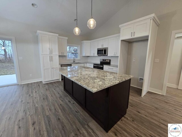 61 NW 247th Rd, Clinton, MO 64735 - kitchen with a sink, stainless steel appliances, a center island, backsplash, and white cabinets