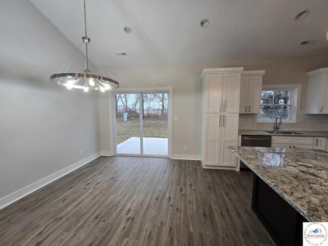 61 NW 247th Rd, Clinton, MO 64735 - unfurnished dining area with dark wood-style floors, an inviting chandelier, a sink, and baseboards