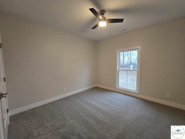 61 NW 247th Rd, Clinton, MO 64735 - empty room featuring dark colored carpet, visible vents, a ceiling fan, and baseboards