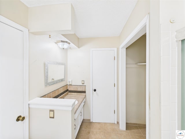 bathroom with vanity and tile patterned flooring