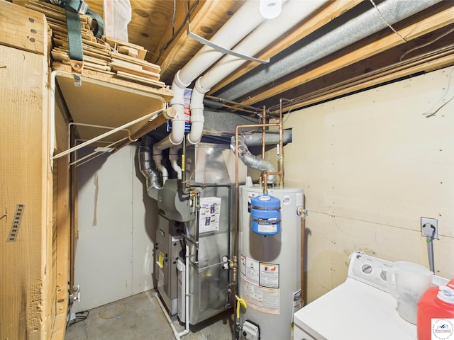 utilities with gas water heater and washer / dryer