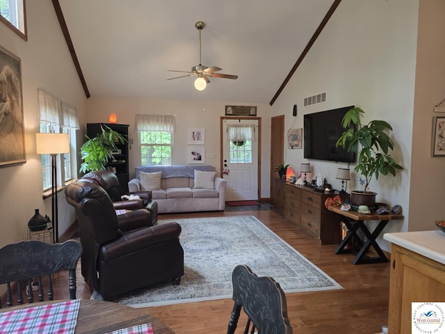 27349 Karrs Ave, Warsaw, MO 65355 - living area featuring high vaulted ceiling, a ceiling fan, dark wood-style floors, and beam ceiling
