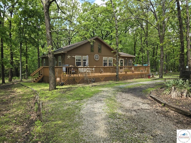 27349 Karrs Ave, Warsaw, MO 65355 - view of front of home with a deck, driveway, and a wooded view