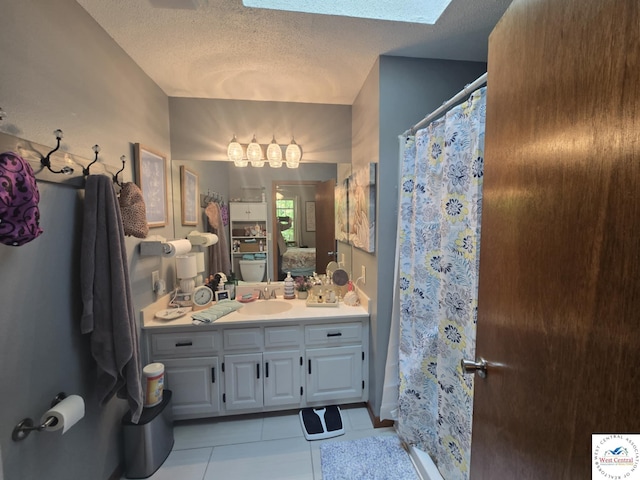 27349 Karrs Ave, Warsaw, MO 65355 - bathroom with a textured ceiling, tile patterned floors, vanity, and curtained shower