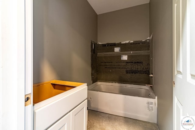 full bathroom with a bathtub and concrete floors