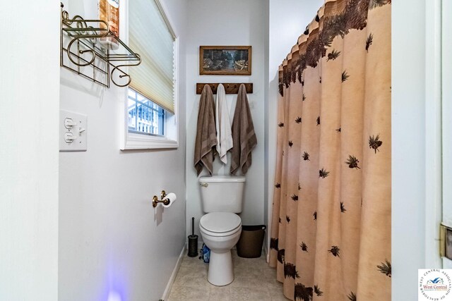 25733 Macks Ave, Warsaw, MO 65355 - full bathroom with toilet, tile patterned flooring, and baseboards