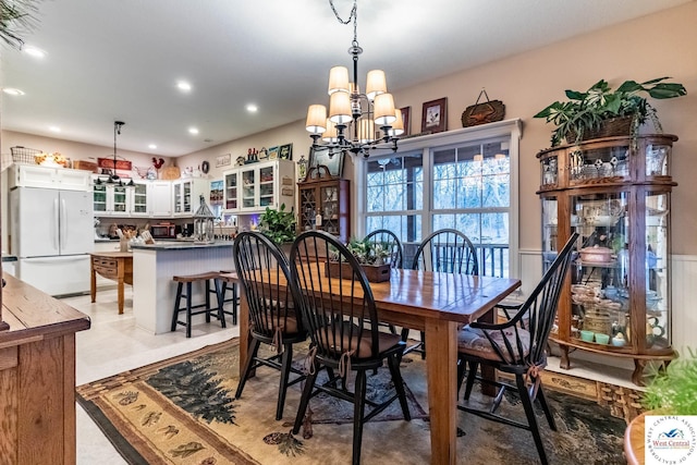 25733 Macks Ave, Warsaw, MO 65355 - dining area featuring recessed lighting, a wainscoted wall, and an inviting chandelier