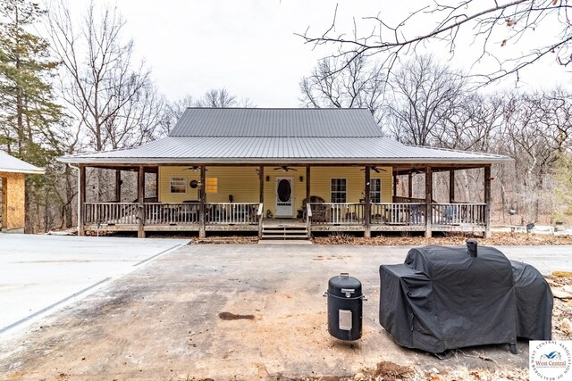 25733 Macks Ave, Warsaw, MO 65355 - view of front of home featuring covered porch, a ceiling fan, and metal roof