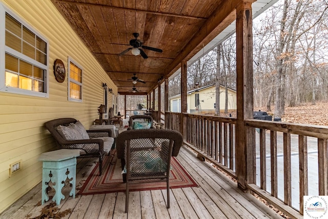 25733 Macks Ave, Warsaw, MO 65355 - deck featuring an outdoor living space and a ceiling fan