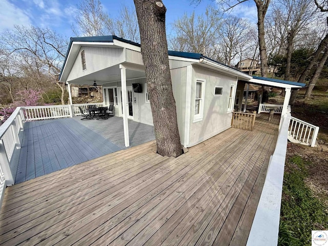 wooden deck with outdoor dining space