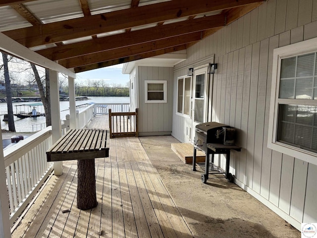 wooden terrace with a water view