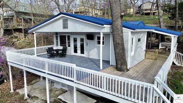 wooden deck featuring french doors