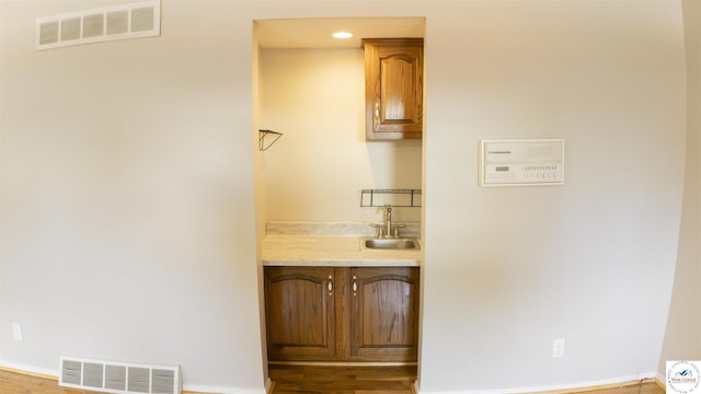 1903 E Alfresco St, Clinton, MO 64735 - bar area featuring a sink and baseboards