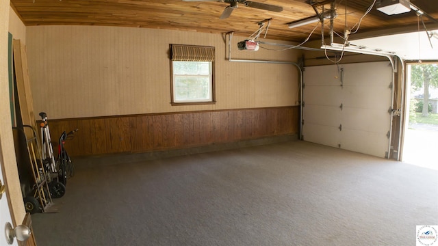 1903 E Alfresco St, Clinton, MO 64735 - garage featuring wooden walls, a garage door opener, and wooden ceiling