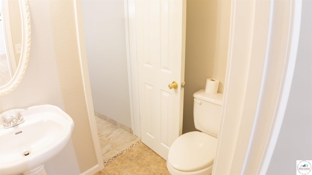1903 E Alfresco St, Clinton, MO 64735 - half bath with a sink and tile patterned flooring