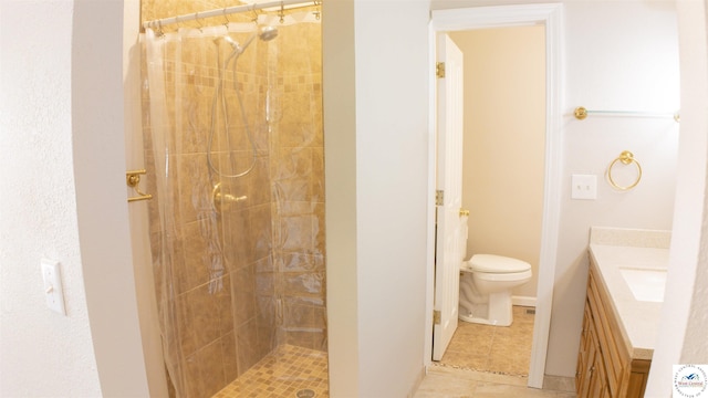 1903 E Alfresco St, Clinton, MO 64735 - bathroom with vanity, a tile shower, and tile patterned floors