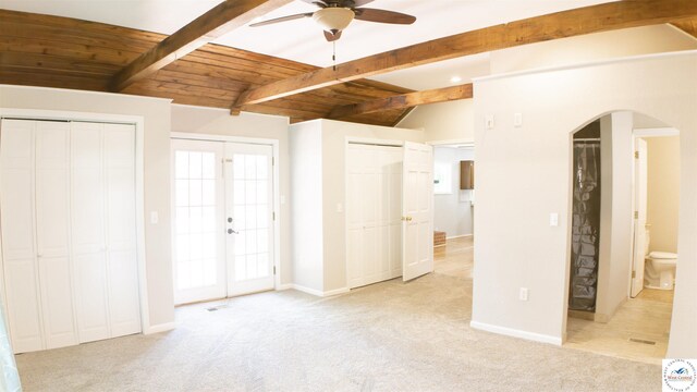 1903 E Alfresco St, Clinton, MO 64735 - unfurnished bedroom featuring carpet flooring, french doors, arched walkways, multiple closets, and wooden ceiling