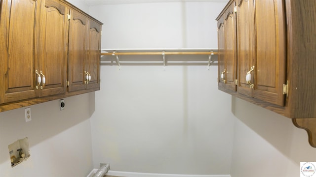 1903 E Alfresco St, Clinton, MO 64735 - washroom featuring hookup for an electric dryer, cabinet space, and hookup for a washing machine