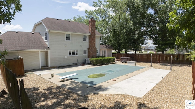 1903 E Alfresco St, Clinton, MO 64735 - view of swimming pool featuring a patio, a fenced backyard, and a diving board