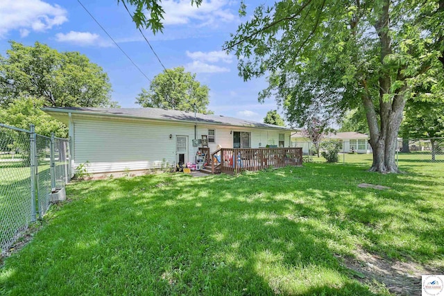 rear view of house with a wooden deck