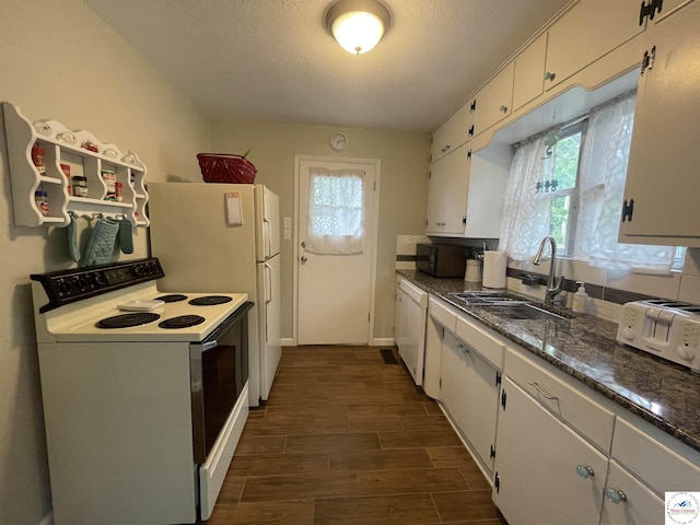 26835 Carefree Ln, Warsaw, MO 65355 - kitchen featuring white appliances, a sink, dark wood finished floors, white cabinets, and a textured ceiling