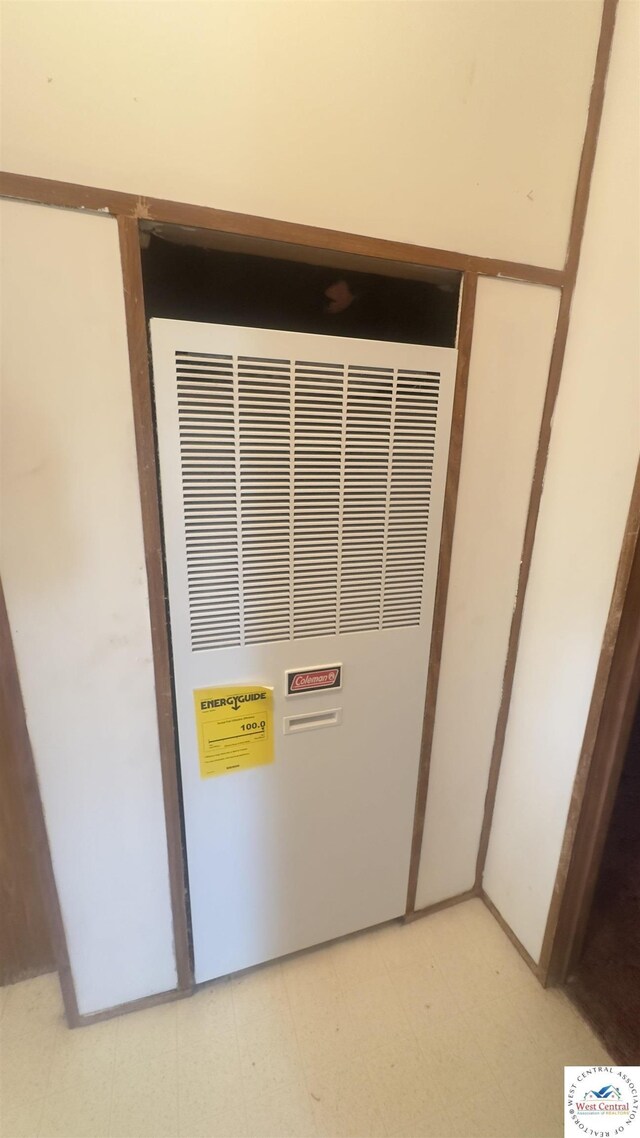 386 SE 1151st Rd, Clinton, MO 64735 - detailed view of tile patterned floors and a heating unit