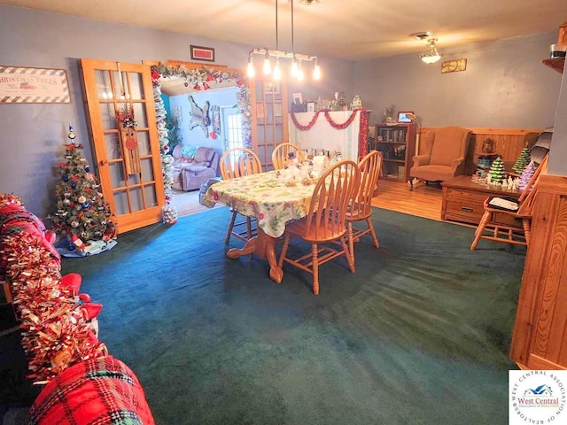 dining space with carpet flooring