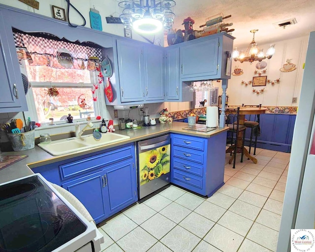 kitchen with dishwashing machine, blue cabinetry, and a sink