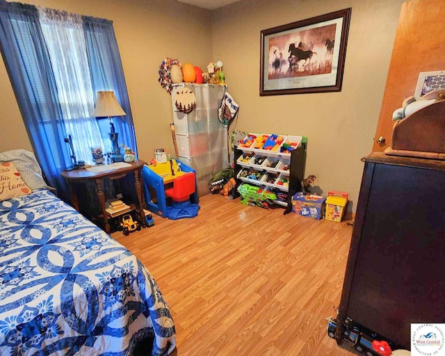 bedroom featuring wood finished floors