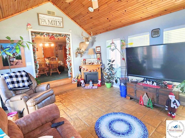 living area with wood ceiling and vaulted ceiling