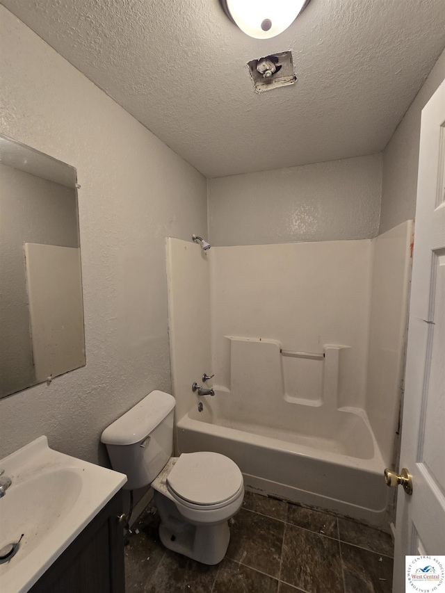 511 S Carter St, Clinton, MO 64735 - bathroom featuring vanity, shower / tub combination, and a textured ceiling