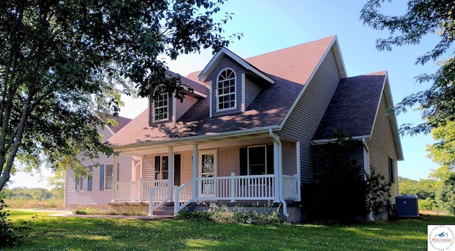 1766 NW M Hwy, Clinton, MO 64735 - cape cod house with a porch, a front yard, and a shingled roof