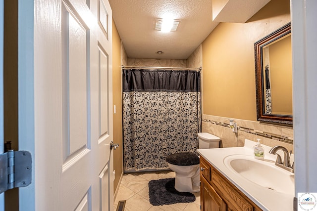1766 NW M Hwy, Clinton, MO 64735 - bathroom with tile patterned flooring, vanity, a textured ceiling, curtained shower, and a wainscoted wall